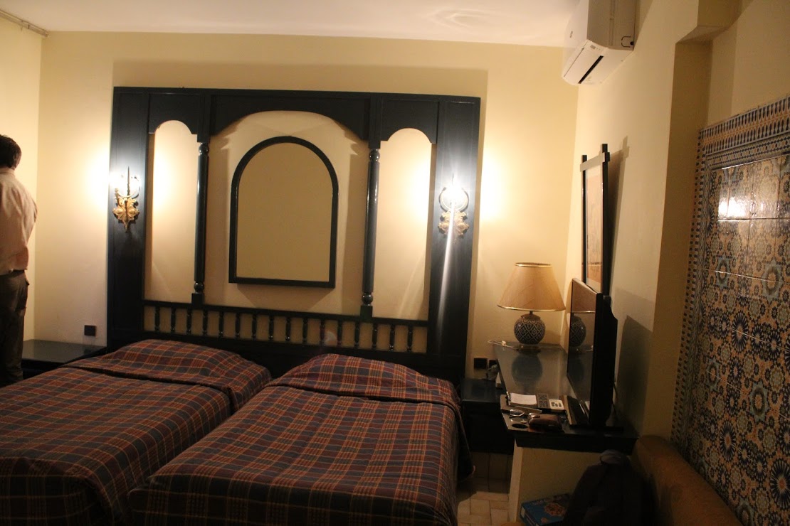 The room — small beds and dark